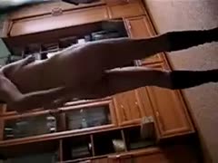On livecam, a slutty, skinny wife wearing sagging pants dances while dressed in natural clothing.